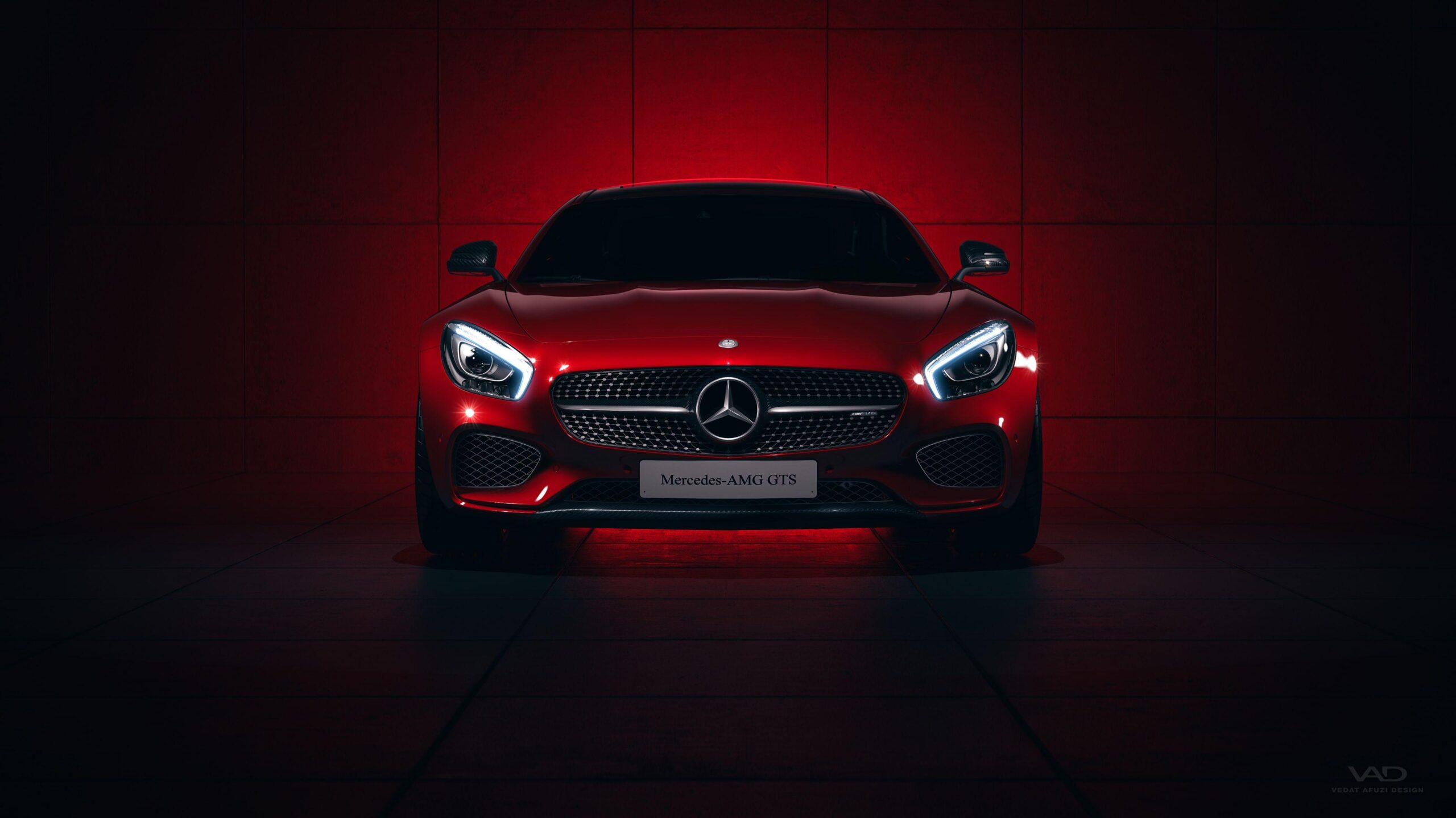 Red Mercedes-AMG GT in a dark red studio